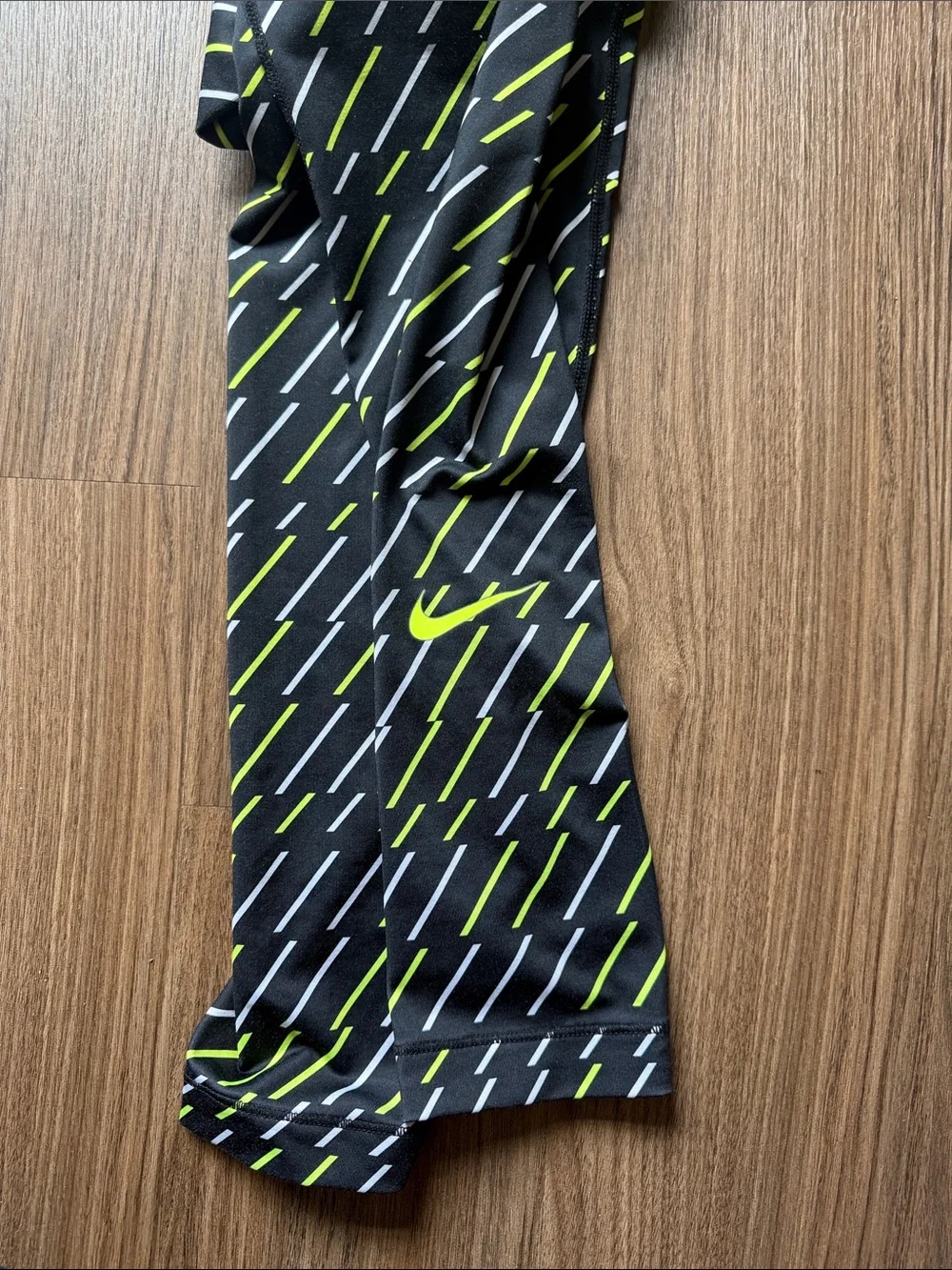 Nike Black Leggings with Neon Yellow and White Dash Pattern